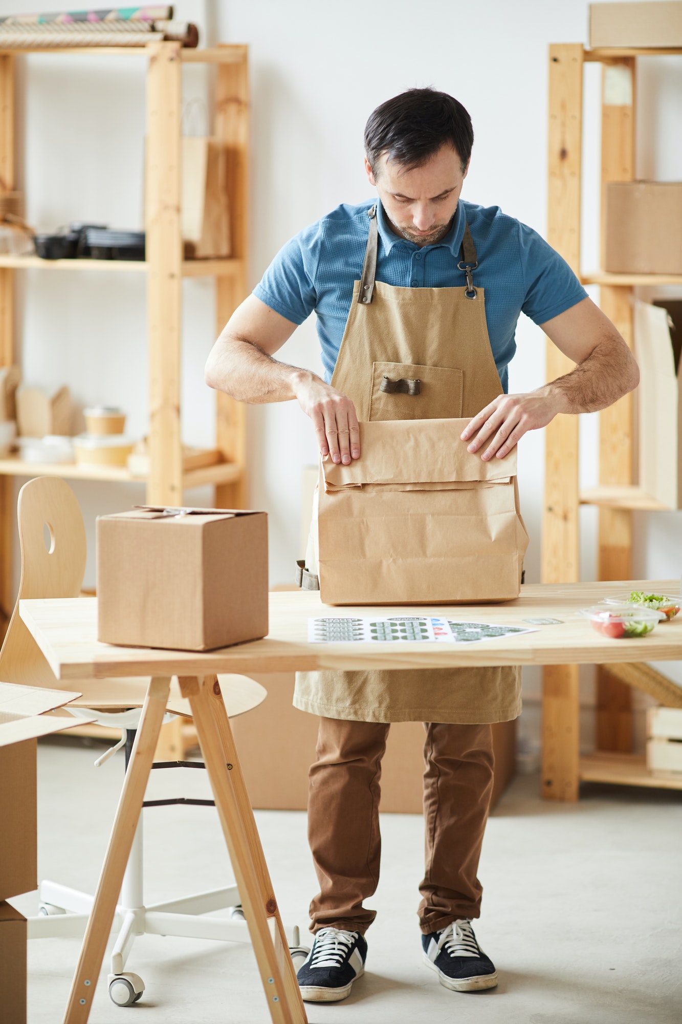 Man Packaging Orders at Food Delivery